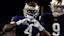 Notre Dame Fighting Irish running back Jeremiyah Love (4) shares a heart with the fans.