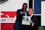 Rolando Blackman of the Dallas Mavericks reacts with Mark Tatum NBA Deputy Commissioner after winning the the first pick during the 2025 NBA Draft Lottery at McCormick Place. David Banks-Imagn Images