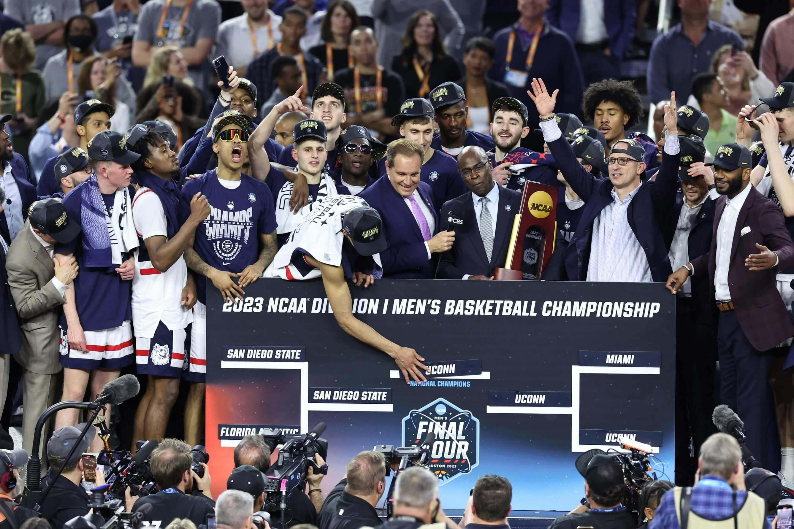 Connecticut Huskies players celebrate after defeating the San Diego State Aztecs in the national championship game of the 2023 NCAA Tournament at NRG Stadium.
