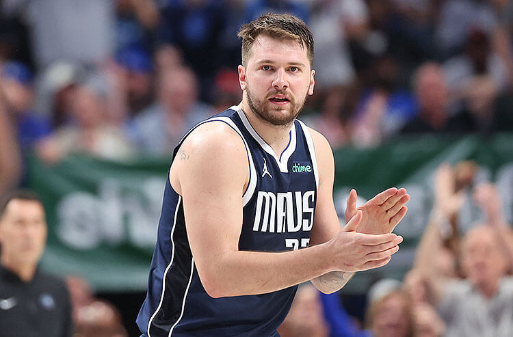 Dallas Mavericks All-NBA guard Luka Doncic celebrates on the court.