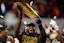 Ohio State Buckeyes wide receiver Jeremiah Smith (4) holds the trophy following the 34-23 win over the Notre Dame Fighting Irish to win the College Football Playoff National Championship at Mercedes-Benz Stadium in Atlanta on Jan. 21, 2025.