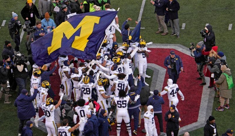 Michigan plants the flag on Ohio State's logo. 