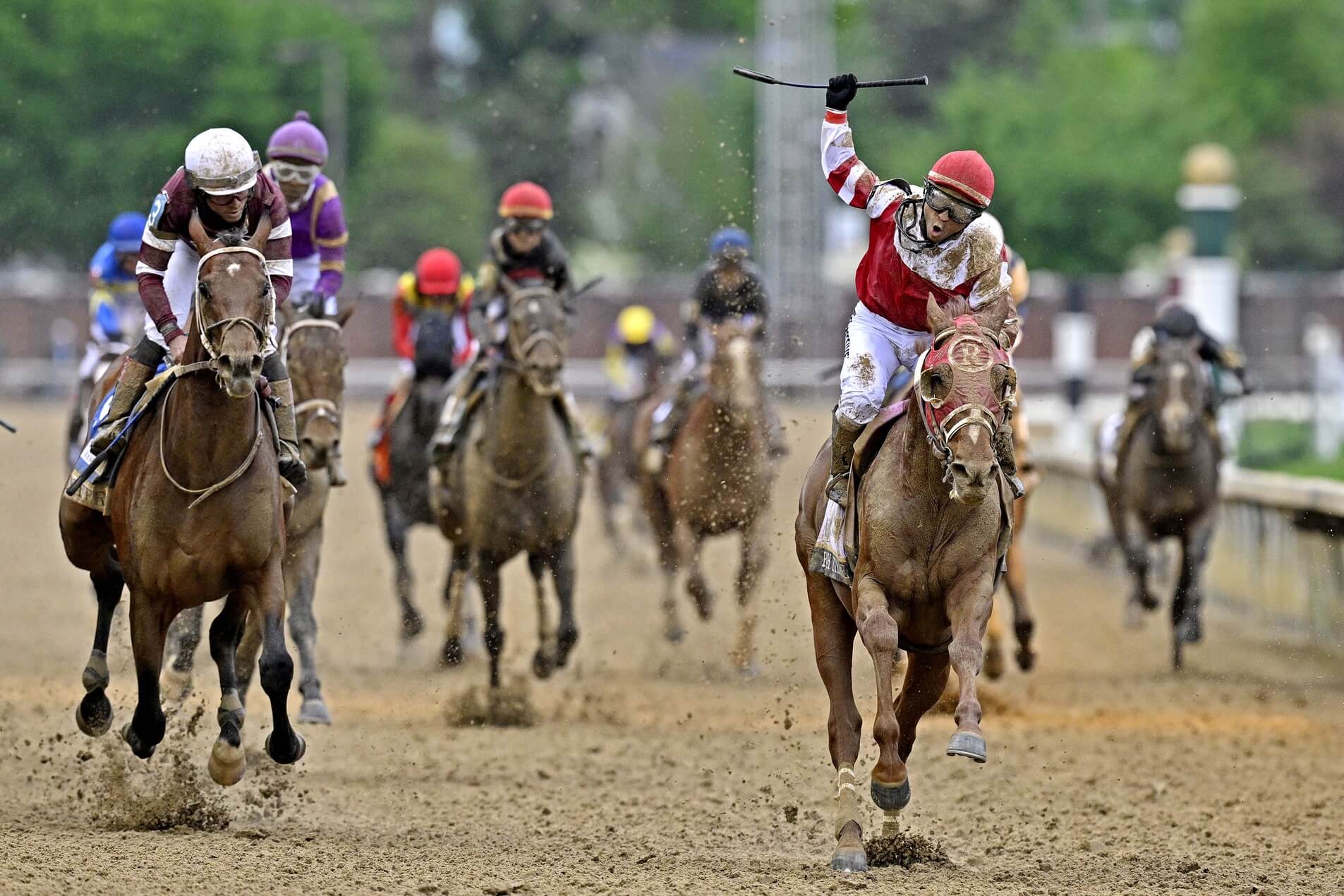 Sonny Leon aboard Rich Strike celebrates winning the 148th running of the Kentucky Derby at Churchill Downs.