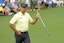 Stewart Cink reacts to his putt on the second hole during the first round of The Masters golf tournament.