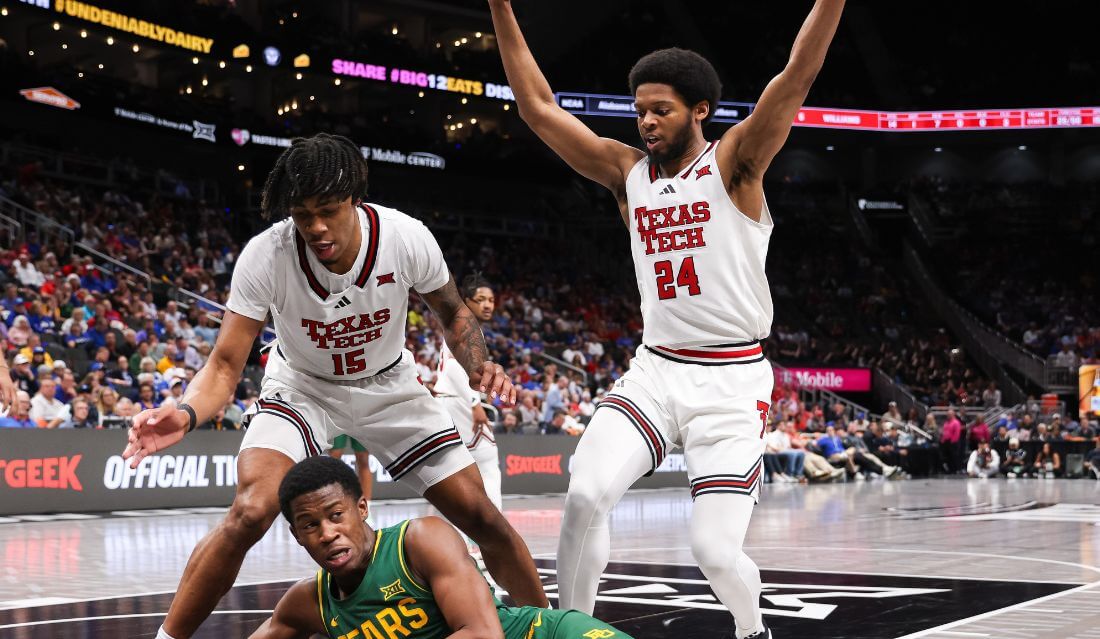 Baylor Bears guard VJ Edgecombe (7) dives on a loose ball during the second half against the Texas Tech Red Raiders.