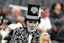 A Las Vegas Raiders fan awaits the start of a game between the Raiders and the Cleveland Browns at Allegiant Stadium.