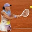 Iga Swiatek of Poland returns a shot during her match against Aryna Sabalenka.