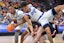 Drake Bulldogs forward Cam Manyawu (3) drives to the basket as teammate Isaiah Jackson (4) topples over Belmont Bruins guard Carter Whitt (2) during the second half at Enterprise Center. Ron Johnson-Imagn Images