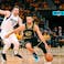 Golden State Warriors guard Stephen Curry (30) dribbles the ball against Dallas Mavericks guard Luka Doncic (77) during the second half of game five of the 2022 western conference finals at Chase Center.