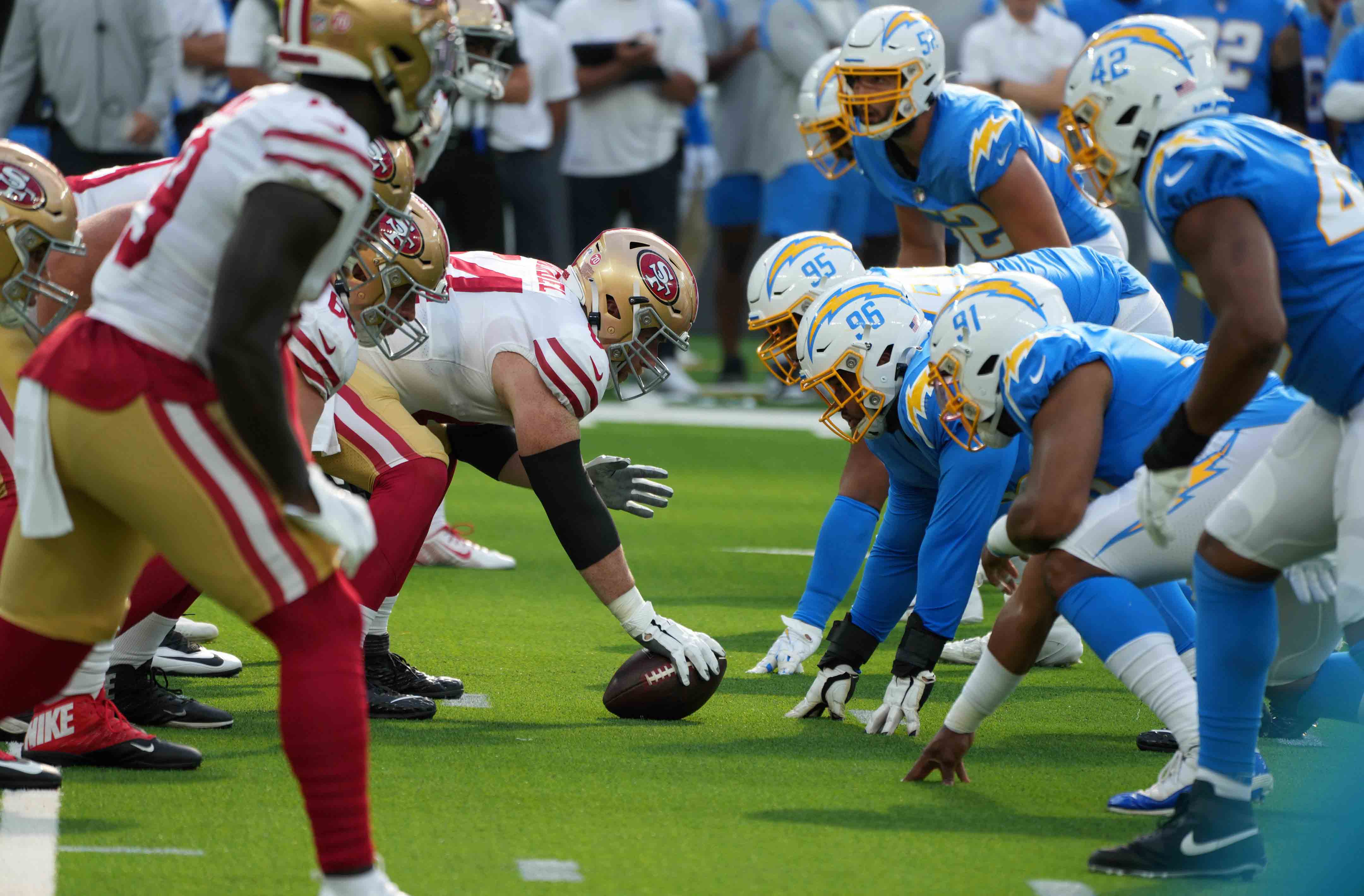 A general overall view of the line of scrimmage as San Francisco 49ers center Jake Brendel (64) snaps the ball against the Los Angeles Chargers at SoFi Stadium.