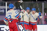 New York Rangers left wing Artemi Panarin (10) celebrates with Alexis Lafreniere (13) and Mika Zibanejad (93) after scoring a goal against the Florida Panthers in the 2026 Winter Classic at loanDepot Park. Sam Navarro-Imagn Im