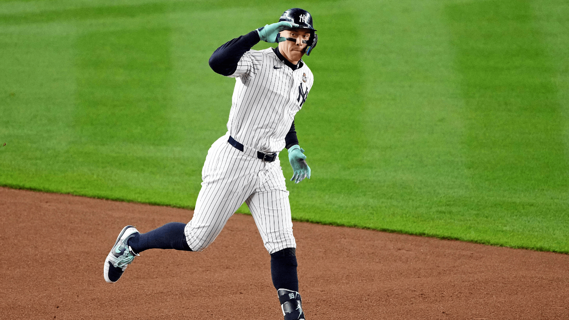 New York Yankees outfielder Aaron Judge (99) celebrates after hitting a two run home run.