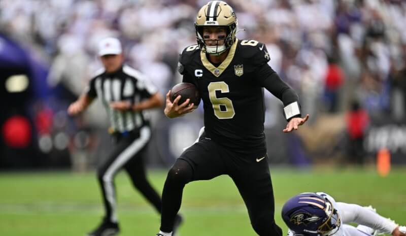 New Orleans Saints quarterback Tyler Shough (6) avoids a tackle.