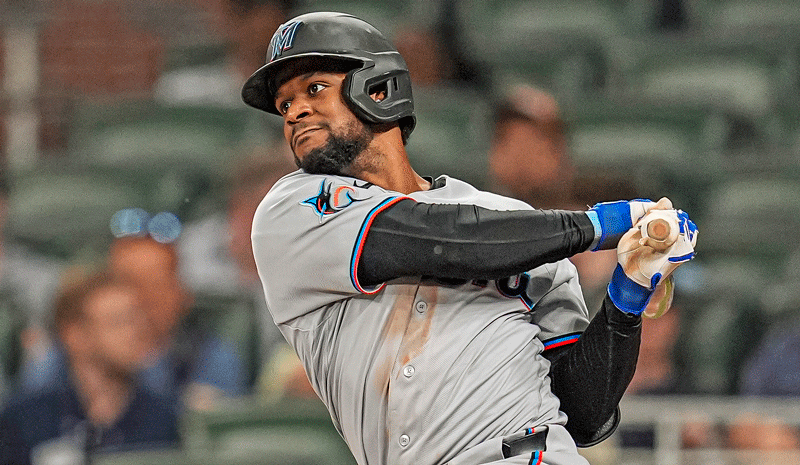 Otto Lopez (6) singles against the Atlanta Braves.