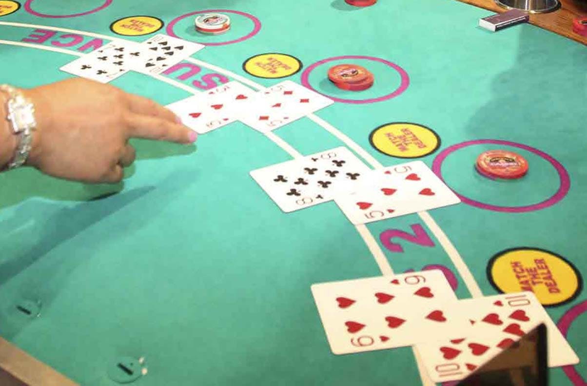 A dealer dealing cards at a Las Vegas blackjack table