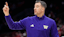 Washington Huskies head coach Danny Sprinkle motions to his team during the first half of the NCAA men's basketball game against the Ohio State Buckeyes.