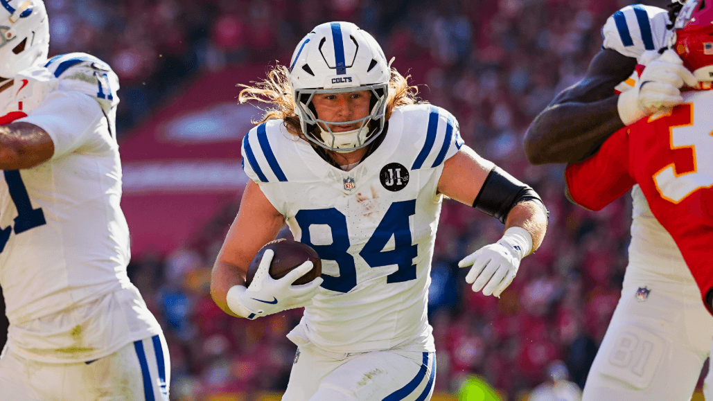 Indianapolis Colts tight end Tyler Warren (84) runs with the ball.