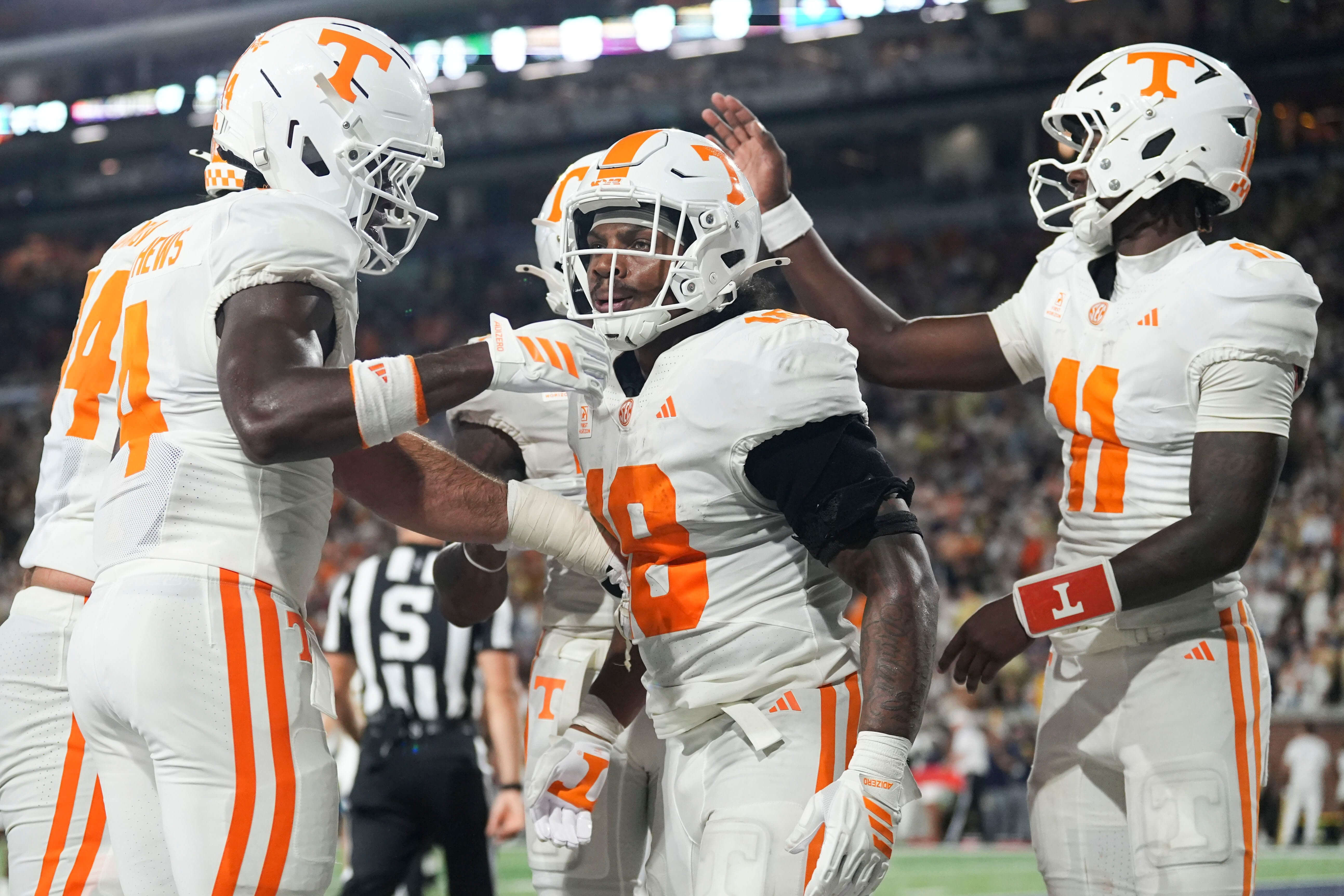 College football AI predictions Week 4, Tennessee running back DeSean Bishop (18) is congratulated after a touchdown.