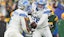 Detroit Lions quarterback Jared Goff hands the ball off to running back David Montgomery.