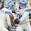 Detroit Lions quarterback Jared Goff hands the ball off to running back David Montgomery.