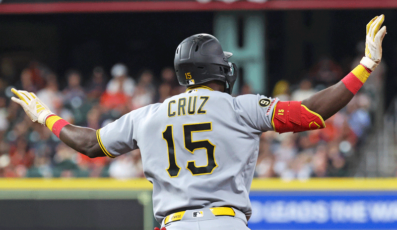 Oneil Cruz (15) celebrates while rounding the bases after hitting a home run.