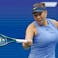 Amanda Anisimova (USA) hits a forehand against Iga Swiatek.