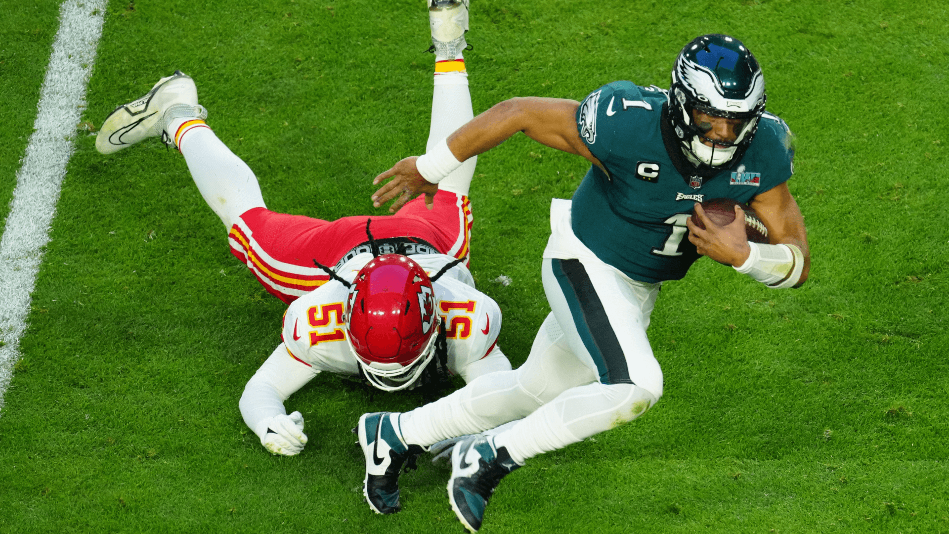 Eagles quarterback Jalen Hurts scrambles for extra yardage.