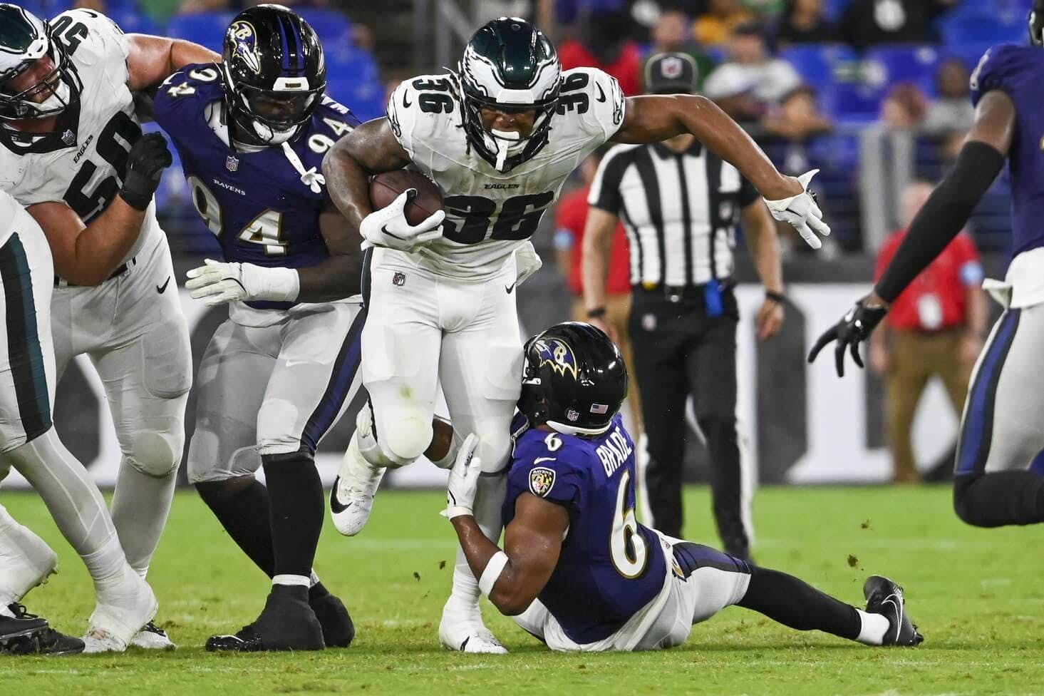 Philadelphia Eagles running back Kendall Milton (36) runs through Baltimore Ravens safety Beau Brade (6) tackle attempt during the second half of a preseason game at M&T Bank Stadium.