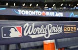 Signage in place on the dug out before game one of the World Series between the Los Angeles Dodgers and Toronto Blue Jays at Rogers Centre. John E. Sokolowski-Imagn Images