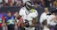 Baltimore Ravens quarterback Lamar Jackson (8) rolls out of the pocket with the ball during the game against the Houston Texans at NRG Stadium.
