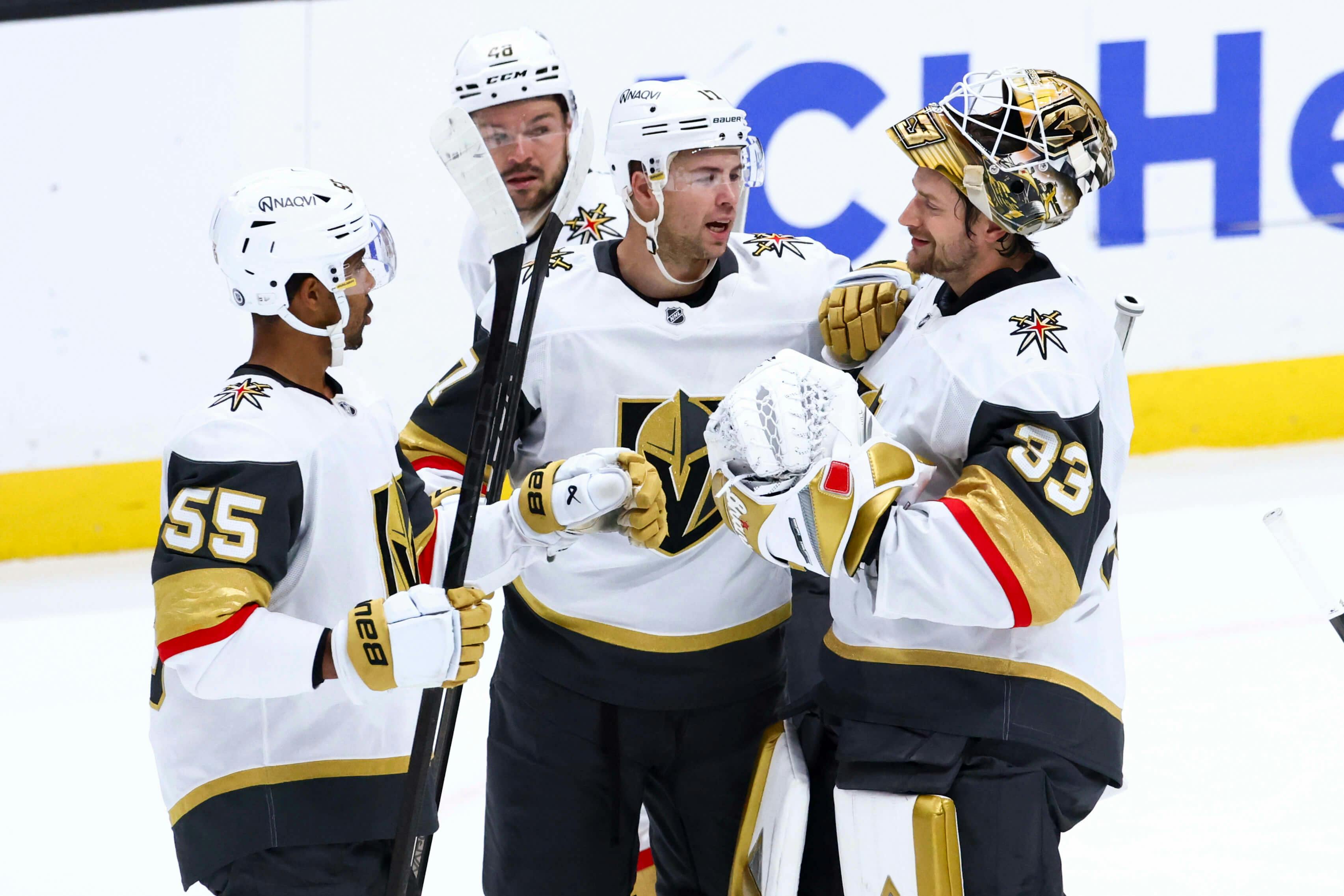 Vegas Golden Knights defenseman Ben Hutton (17) celebrates with goaltender Adin Hill (33) after defeating the Anaheim Ducks during a hockey game at Honda Center. Mandatory Credit: Jessica Alcheh-Imagn Images