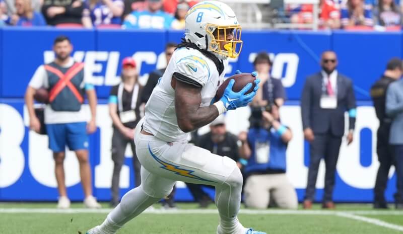 Los Angeles Chargers running back Omarion Hampton (8) carries the ball.
