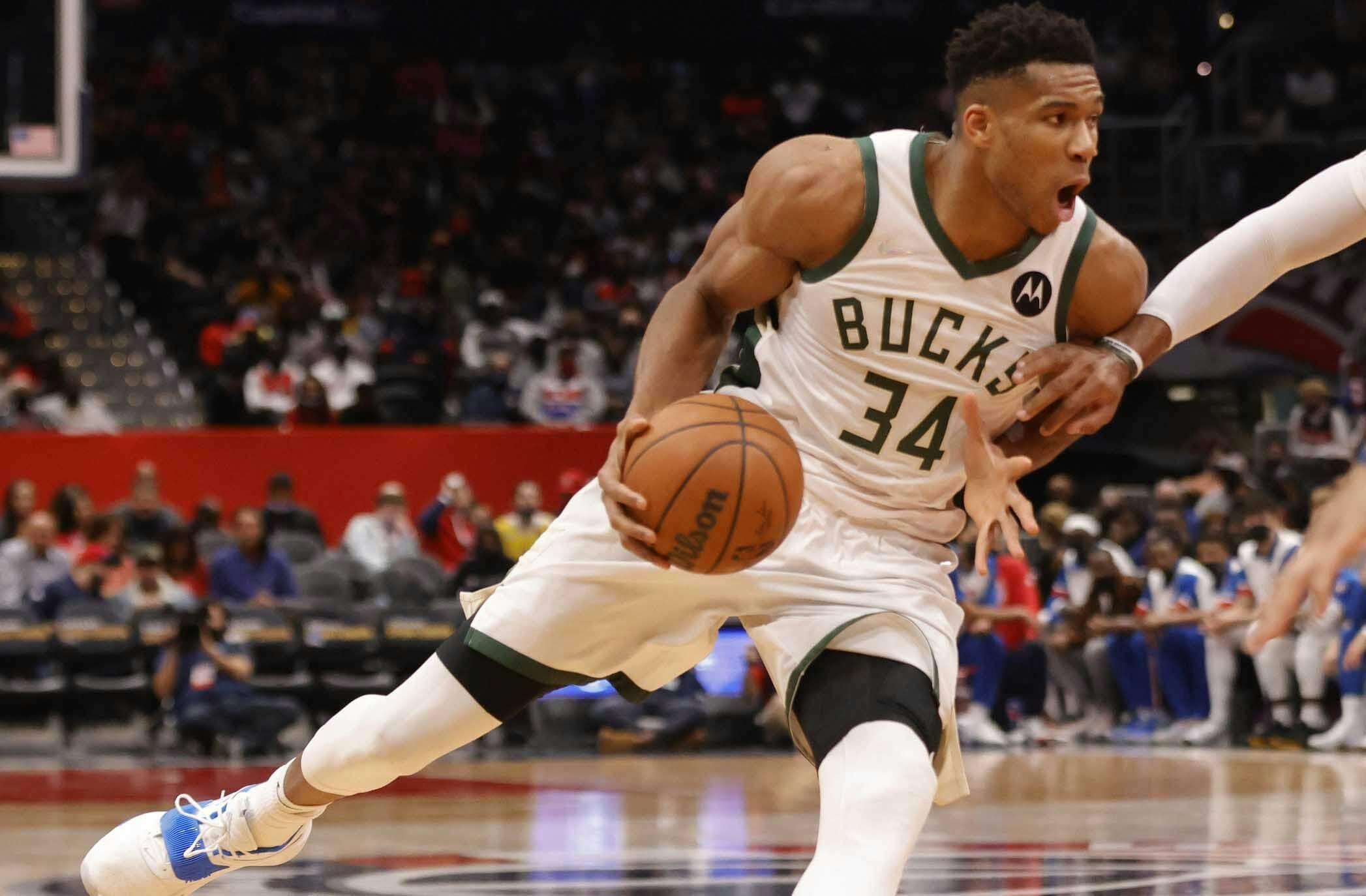 Milwaukee Bucks forward Giannis Antetokounmpo (34) drives to the basket as Washington Wizards center Daniel Gafford (21) defends during the second quarter at Capital One Arena.