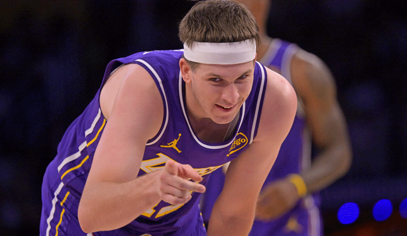 Austin Reaves (15) reacts after a foul in the second half against the Philadelphia 76ers at Crypto.com Arena.