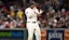 Boston Red Sox designated hitter Rafael Devers (11) reacts after hitting a RBI.