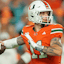 Miami Hurricanes quarterback Carson Beck (11) throws the football against the Louisville Cardinals during the first quarter at Hard Rock Stadium.