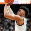 Michigan State guard Jaden Akins (3) makes a jump shot against Minnesota