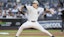 New York Yankees starting pitcher Max Fried (54) pitches in the first inning.