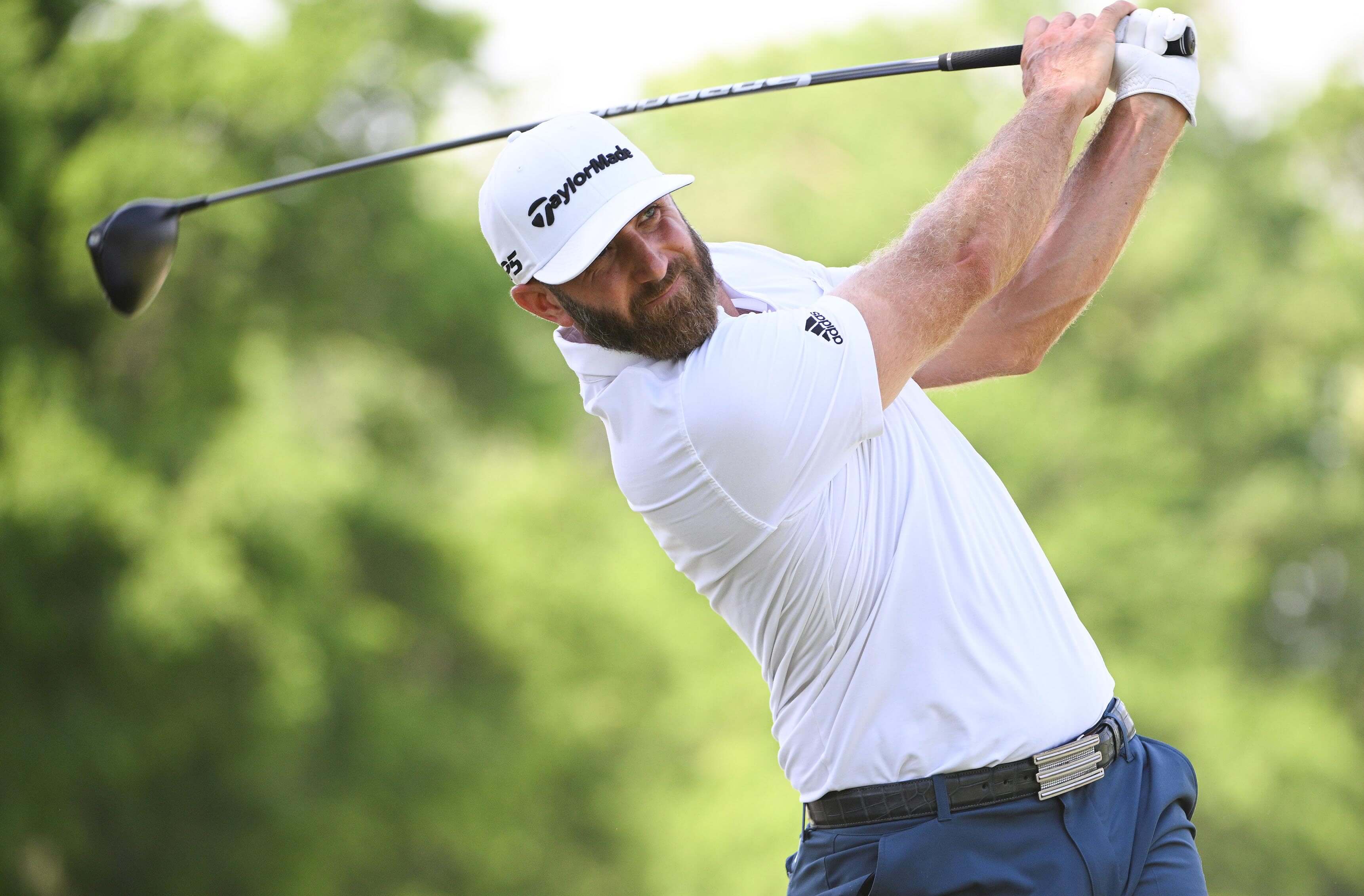 Dustin Johnson plays a shot on the ninth tee during the first round of the PGA Championship golf tournament at Southern Hills Country Club.
