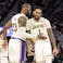Los Angeles Lakers forward LeBron James (23) celebrates with guard D'Angelo Russell (1) during the second overtime against the Golden State Warriors at Chase Center.