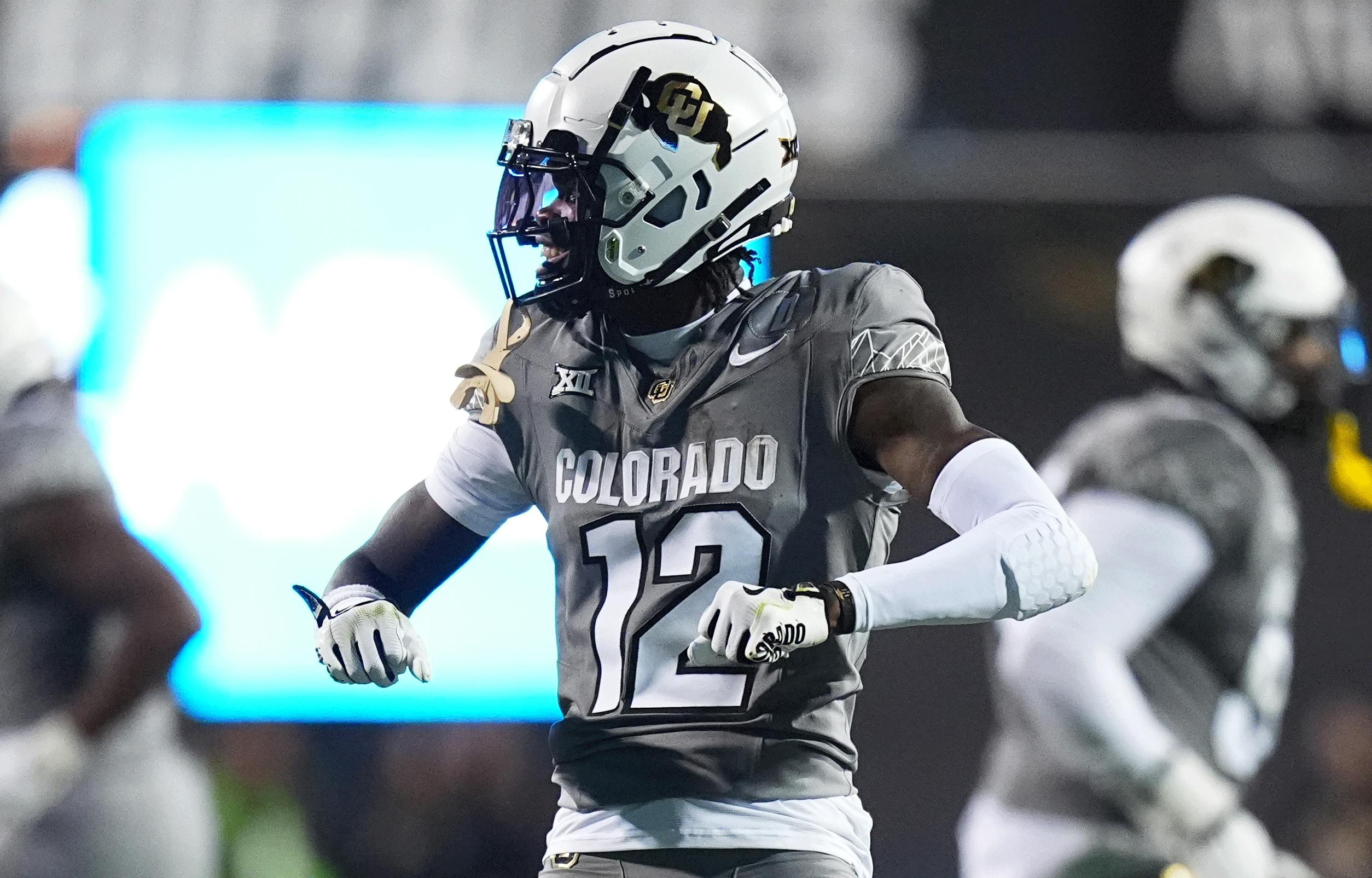 Colorado Buffaloes cornerback Travis Hunter (12) reacts to a play in the second quarter against the Cincinnati Bearcats at Folsom Field. Mandatory Credit: Ron Chenoy-Imagn Images