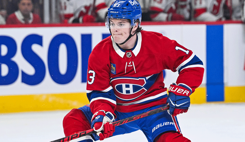 Cole Caufield (13) skates against the New Jersey Devils.