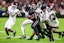  South Carolina Gamecocks running back Raheim Sanders (5) is brought down by Texas A&M Aggies defensive back Marcus Ratcliffe (3) in the second quarter at Williams-Brice Stadium. Mandatory Credit: Jeff Blake-Imagn Images