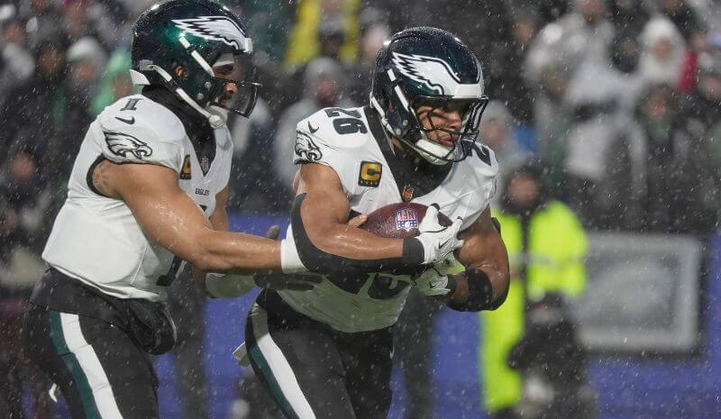Philadelphia Eagles quarterback Jalen Hurts hands the ball off.