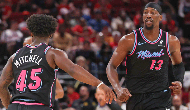 Bam Adebayo (13) reacts to guard Davion Mitchell (45) basket against the Houston Rockets in the first half at Toyota Center. 