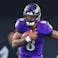 Baltimore Ravens quarterback Lamar Jackson runs for a first down.