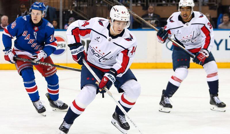 Washington Capitals defenseman Cole Hutson (44) skates with the puck.