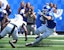 Kentucky’s running back Seth McGowan (3) runs against Toledo’s Avery Smith.
