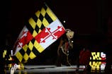Maryland Terrapins mascot waves a flag before the game between the Maryland Terrapins and the Florida A&M Rattlers at Xfinity Center. Reggie Hildred-Imagn Images