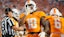 Tennessee running back DeSean Bishop (18) shushes the Mississippi State student section.